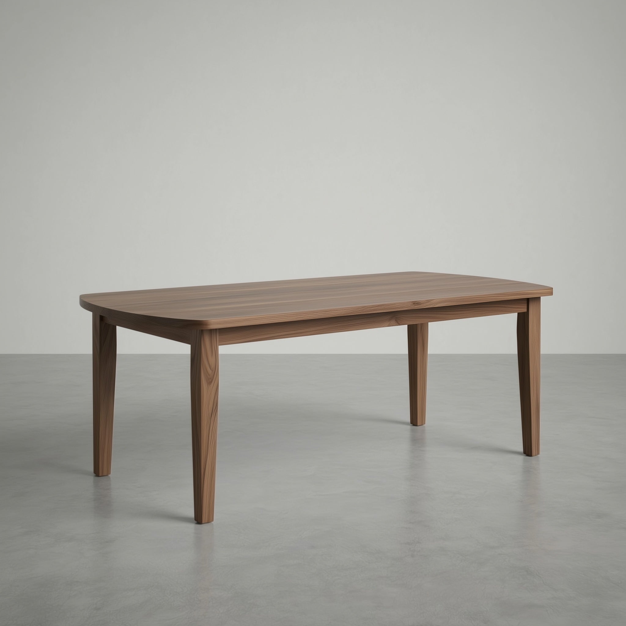 walnut dining table in a large empty space