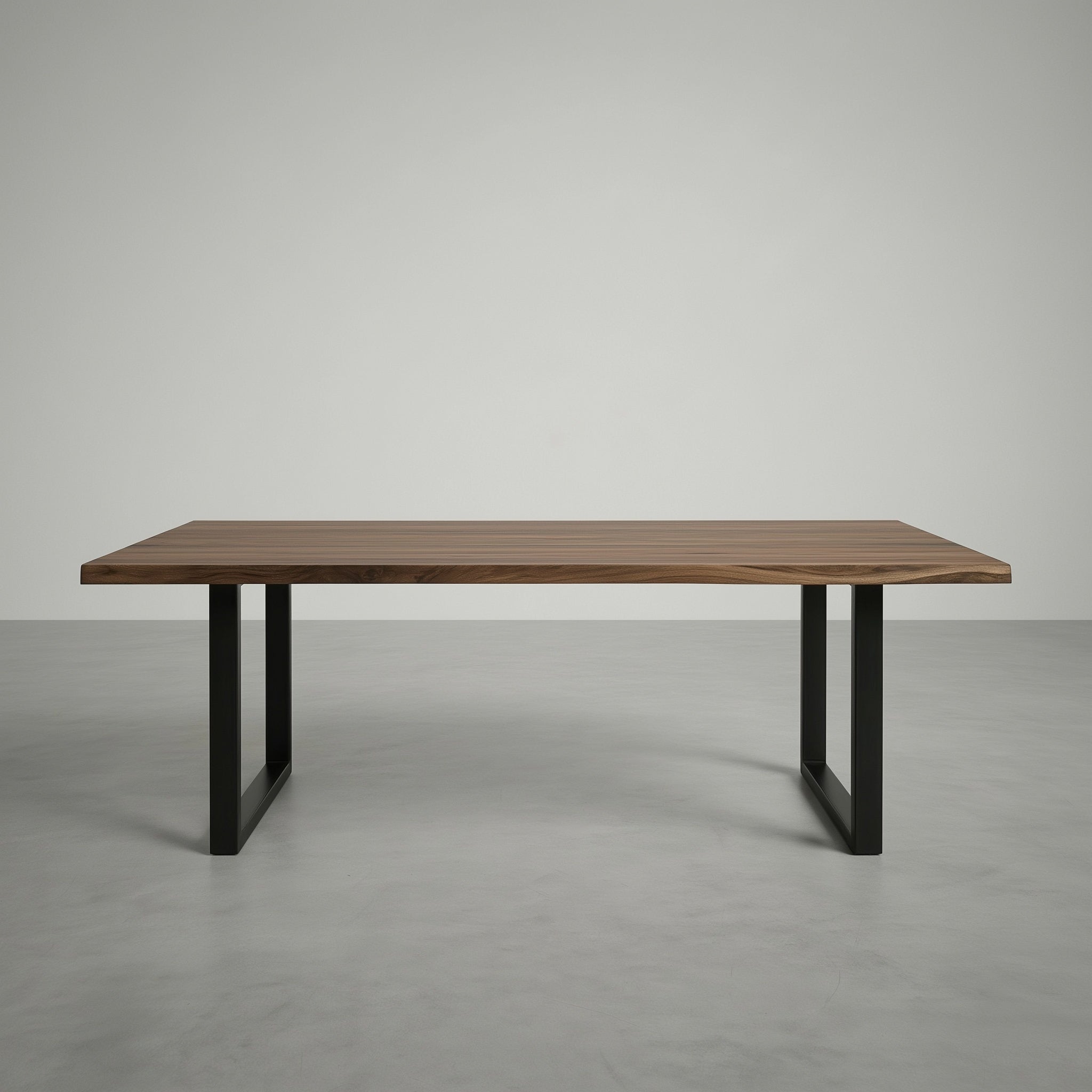 Wooden table with black metal legs on a gray background