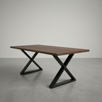 Wooden table with black metal legs on a gray floor and background