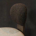 Close up of boucle top dining chair