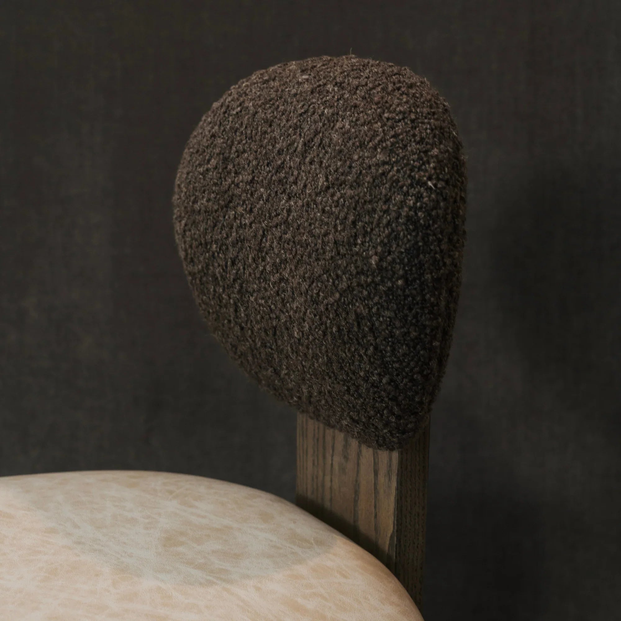 Close up of boucle top dining chair