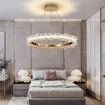 Capri brushed gold crystal ring ceiling light over a dining table