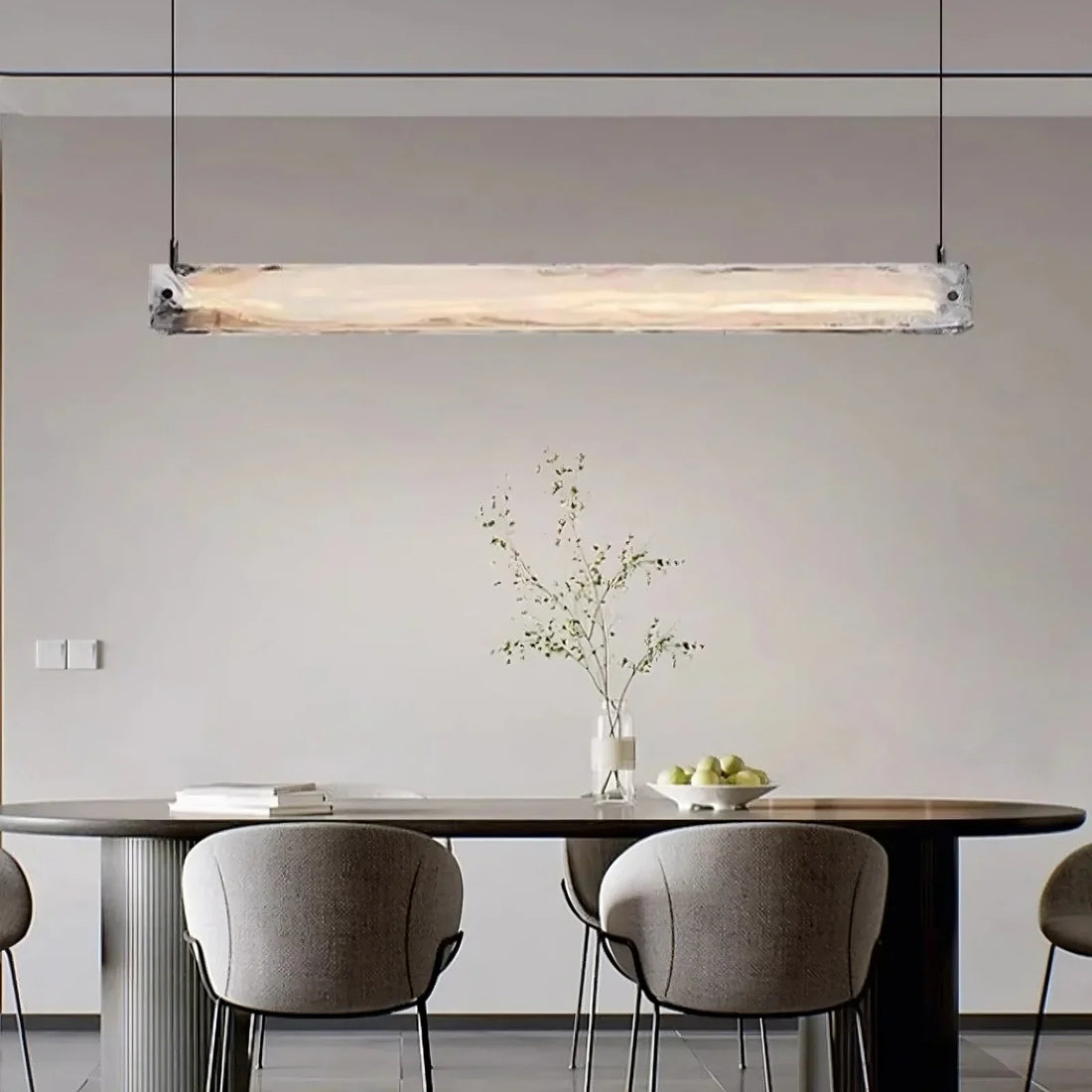 Costa linear glass suspension chandelier over a dining table