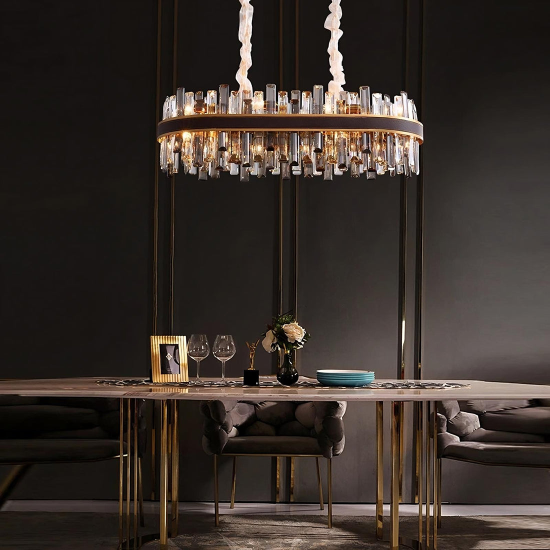 Calvi smoke and clear crystal dining chandelier over a table