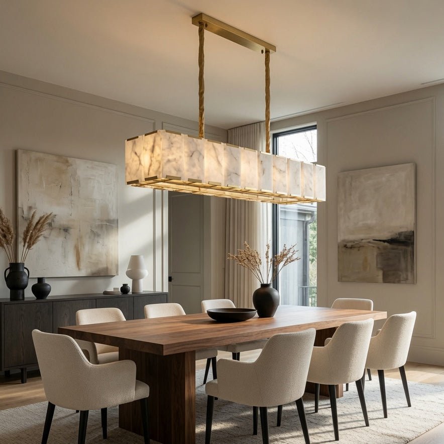 Modern dining room with wooden table, white chairs, and a pendant light.
