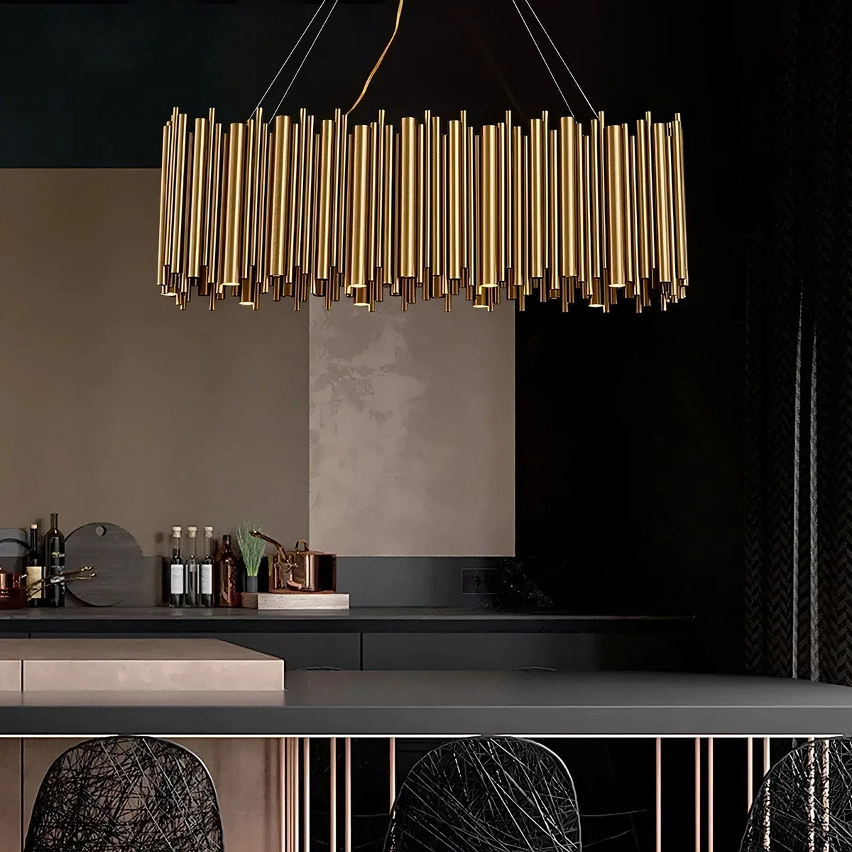 The Vigo gold rectangular chandelier from Morsale.com casting warm light over a dining setting, polished gold steel frame.