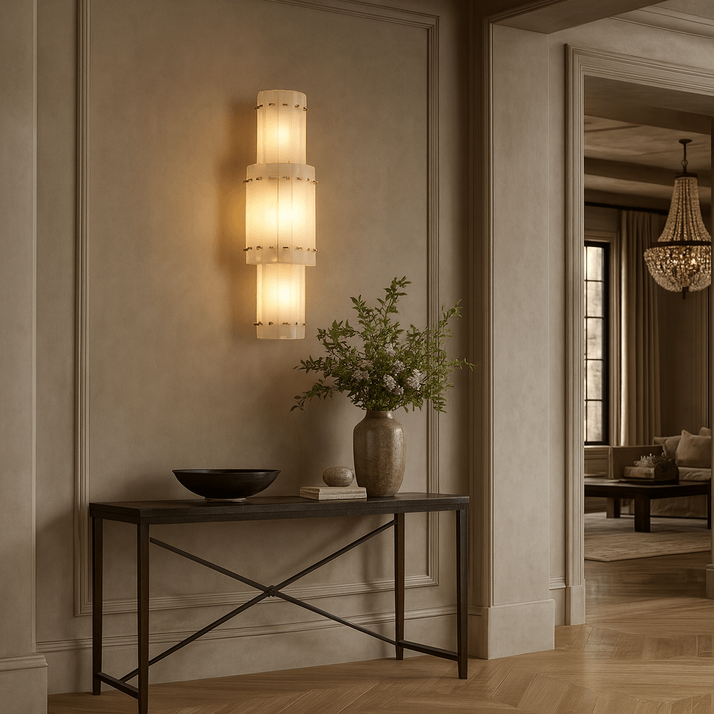 Valmont marble wall sconce mounted on a wall