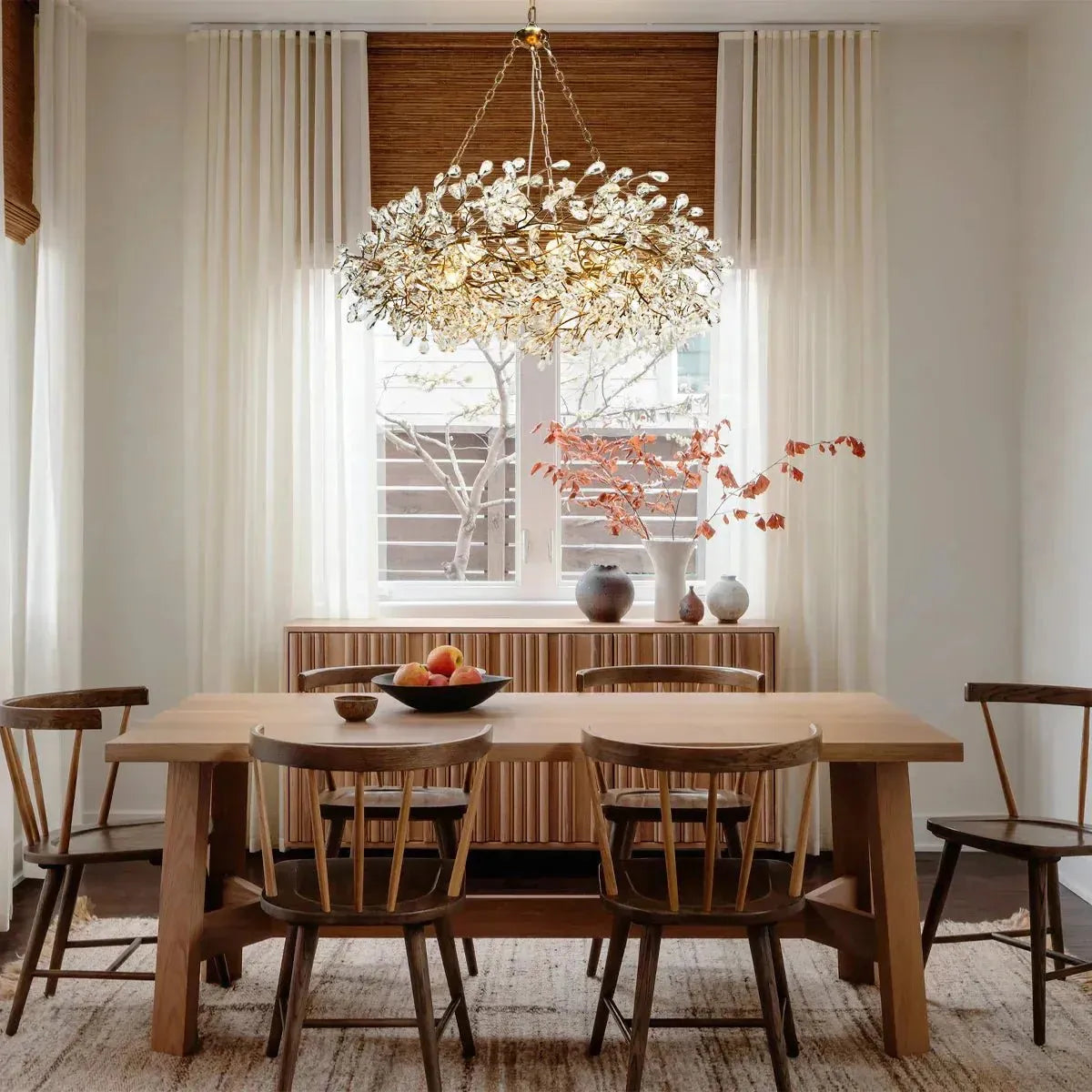 Foglia Crown Crystal Branch Chandelier styled in a modern dining room