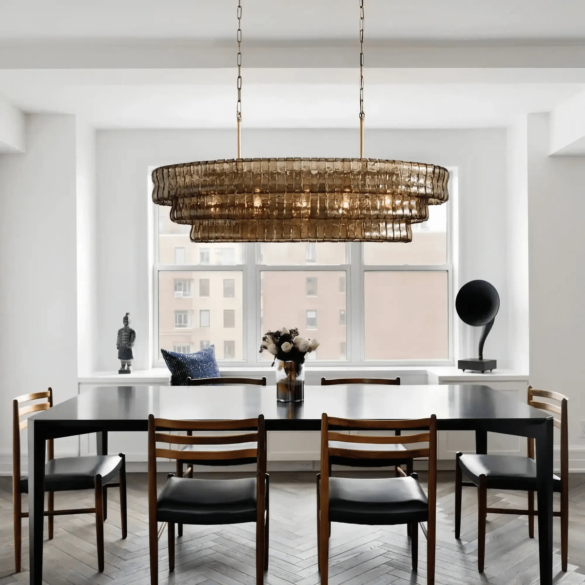 Grigio Glass Oval Chandelier 54''65'' styled in a modern dining room