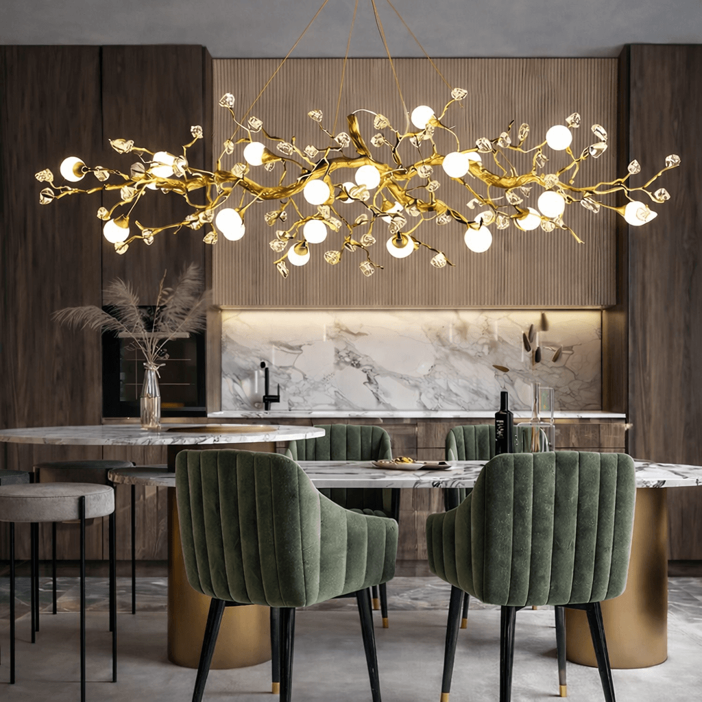 Albero sculptural gold branch chandelier over a dining table