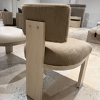 back shot of ocotillo dining chair featuring light wood and hide fabric