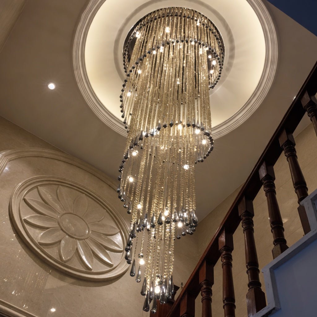 Cascara long crystal chandelier in a two-story foyer