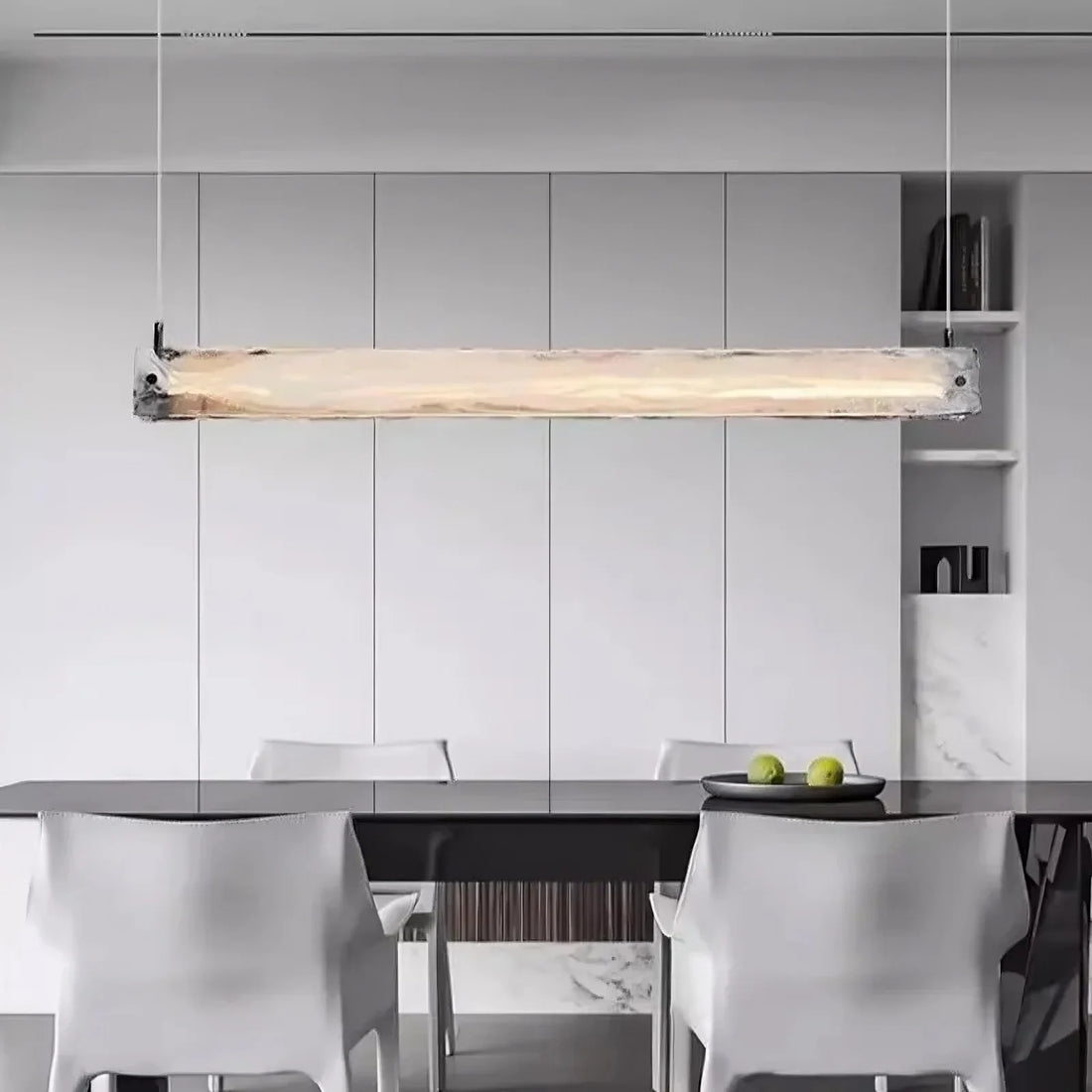 Costa linear glass suspension chandelier over a dining table