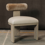 Yucca Dining Chair featuring leather seat and Cylindrical bolster backrest