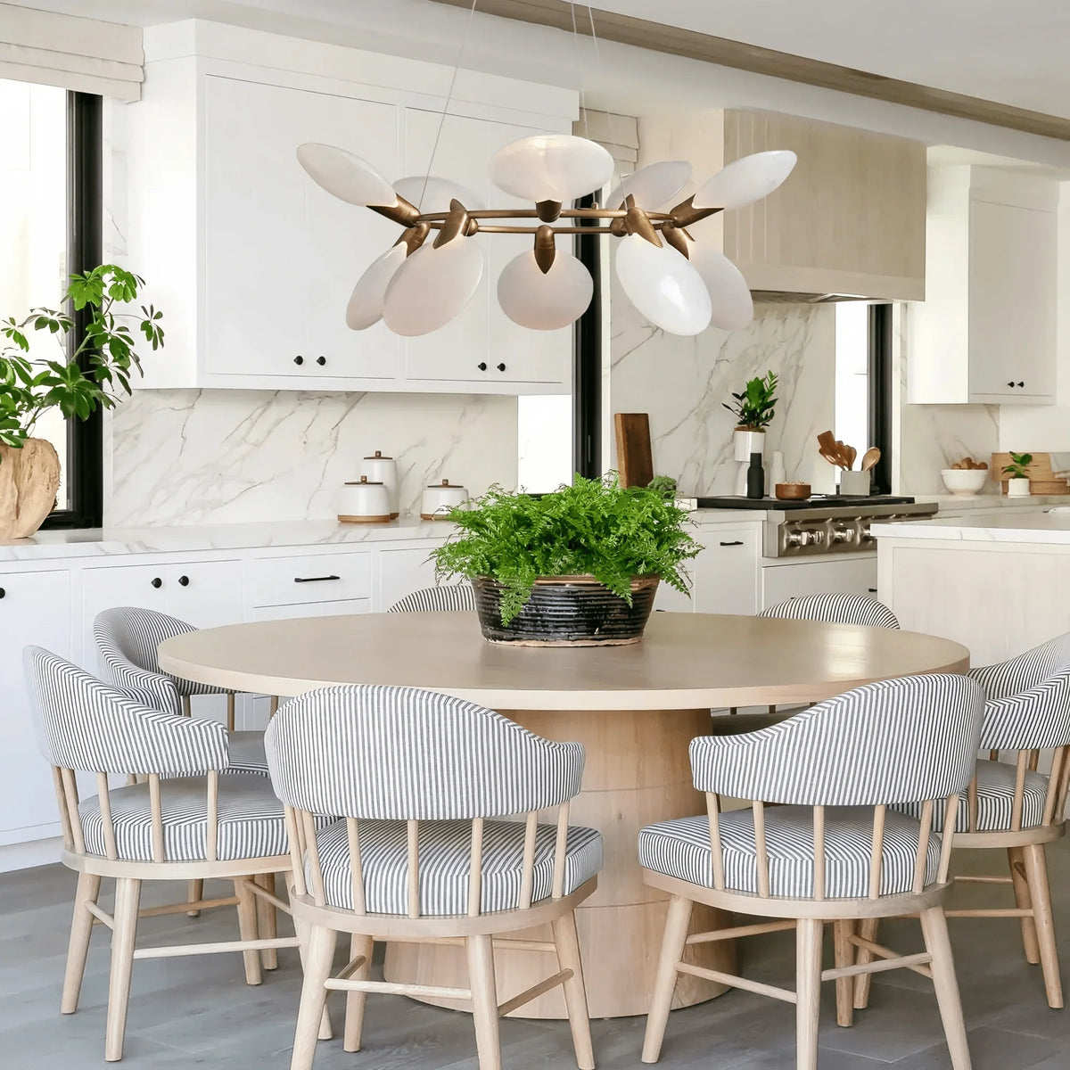 Livia Halo Chandelier in brass - modern dining room lighting