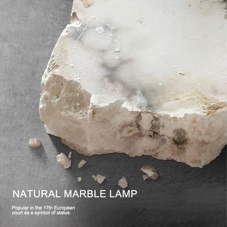 Altura marble disc wall sconce in a bedroom setting