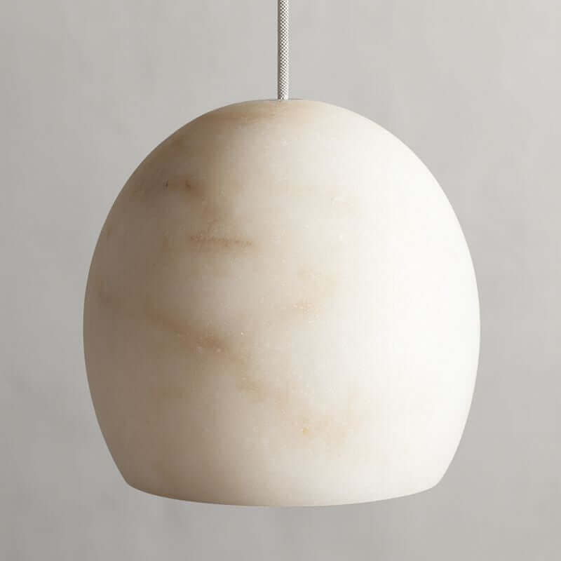 Auris marble chandelier warm glow through stone shades