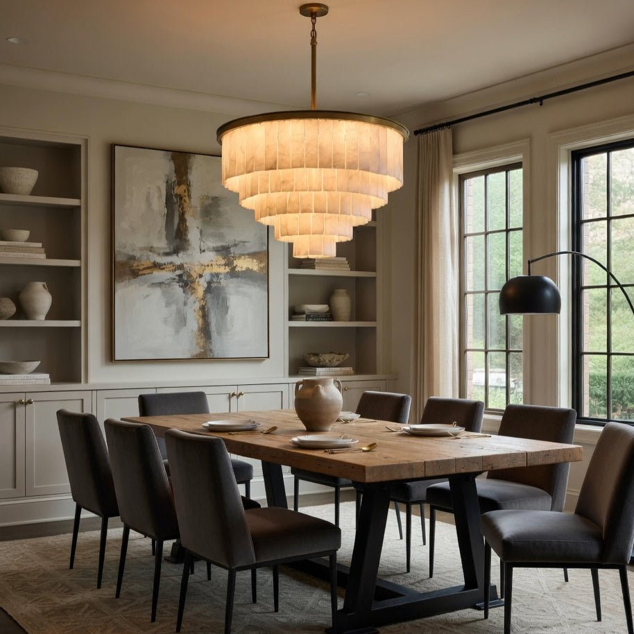 Cascading marble tiles on a brushed brass chandelier frame