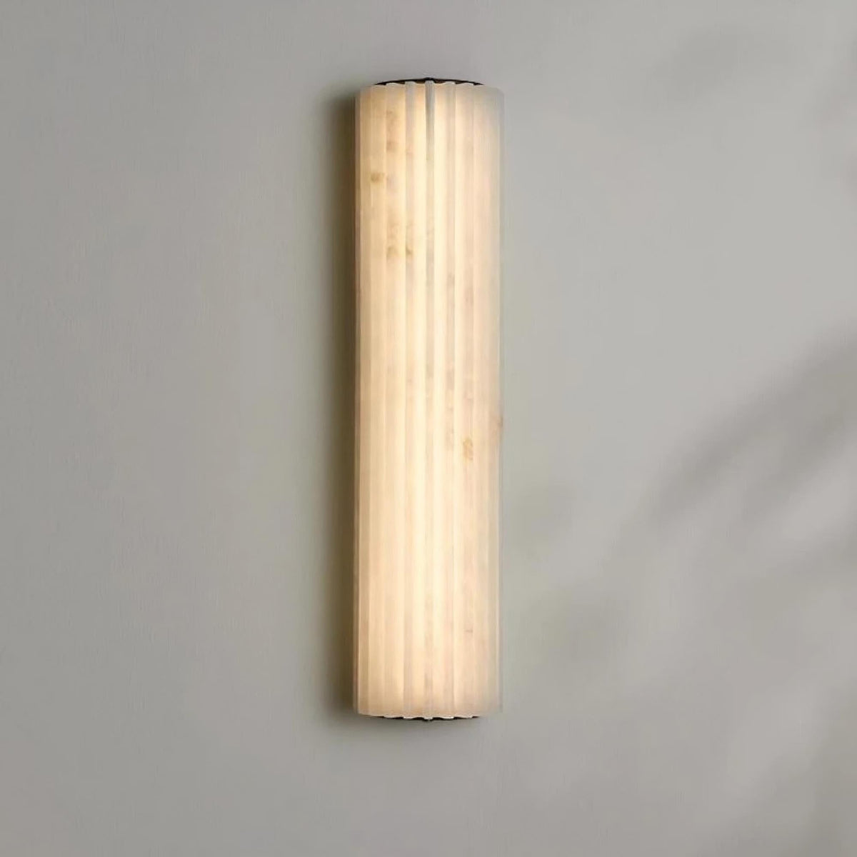 Marlo 18-inch marble wall sconce mounted on a wall