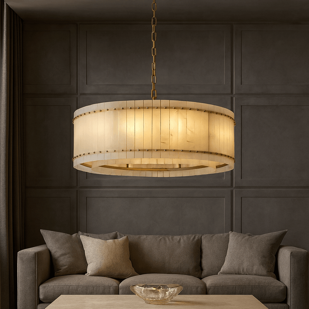 Valmont 39-inch round marble chandelier glowing warm from within