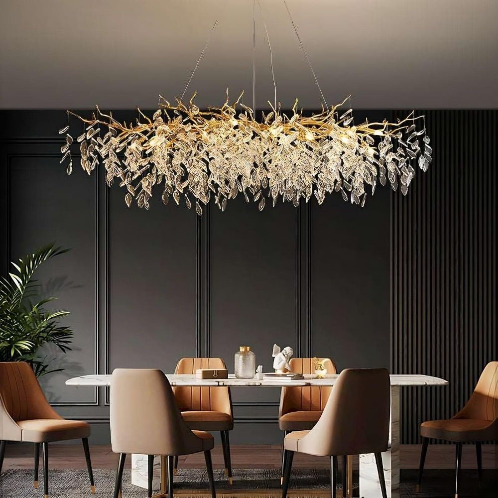 Albero crystal chandelier on a gold frame over a dining table