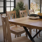 close up image of an oak dining table with black metal legs