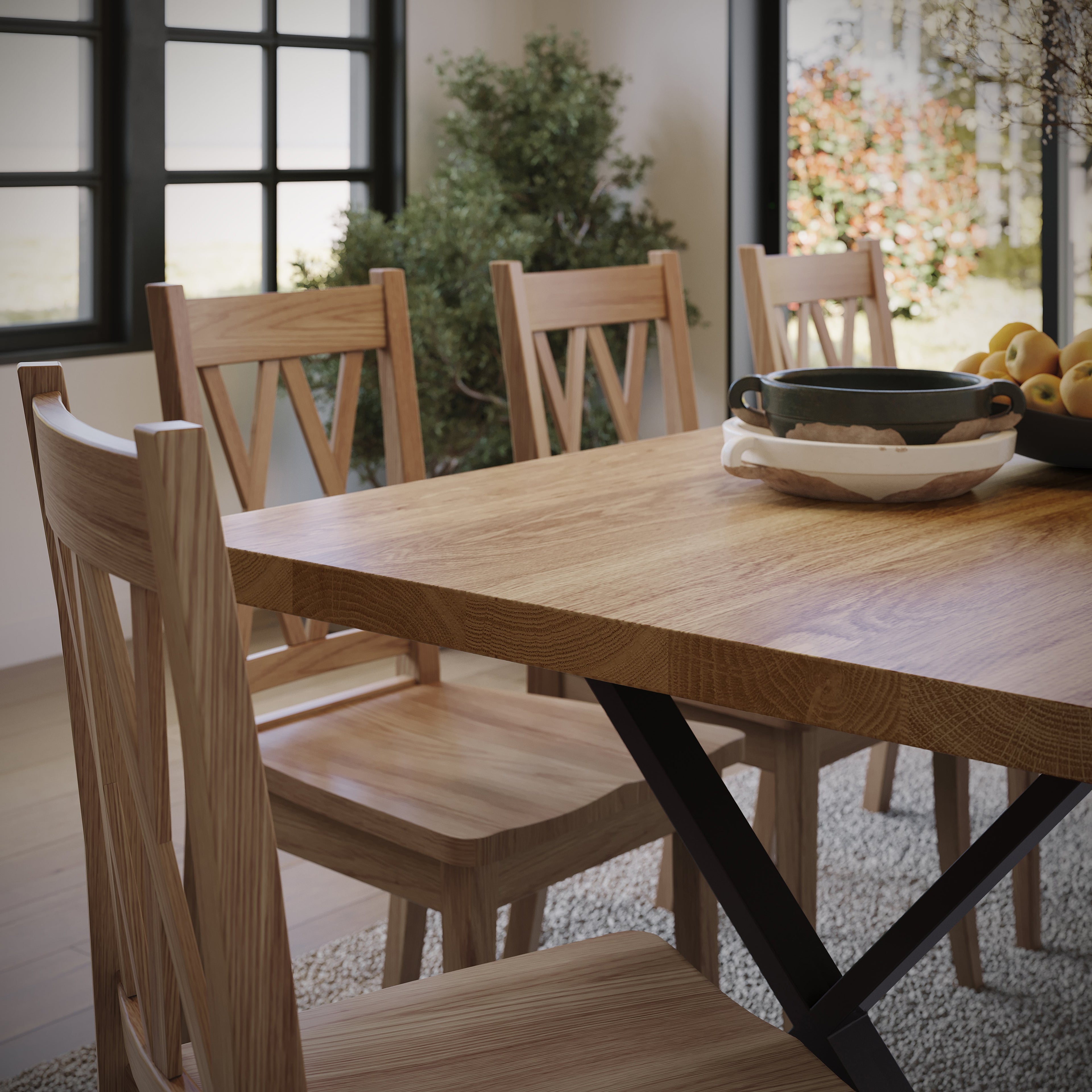 close up image of an oak dining table with black metal legs