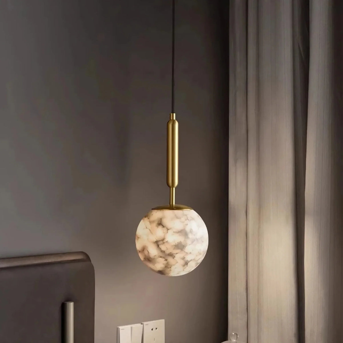 Detail of natural stone grain on the Solara orb pendant