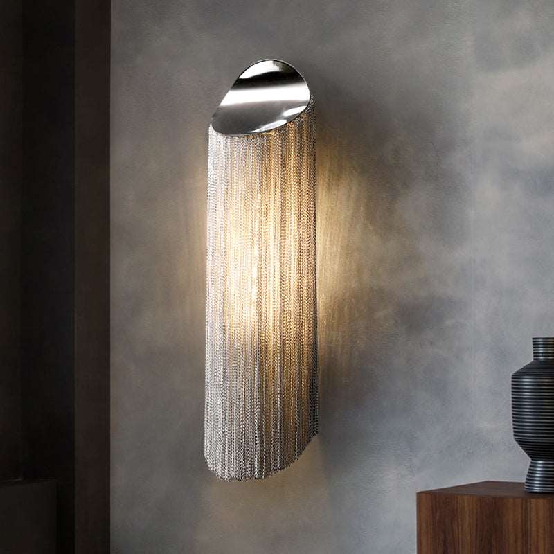 Cadena chain tassel wall sconce with cascading aluminum fringe in a hallway