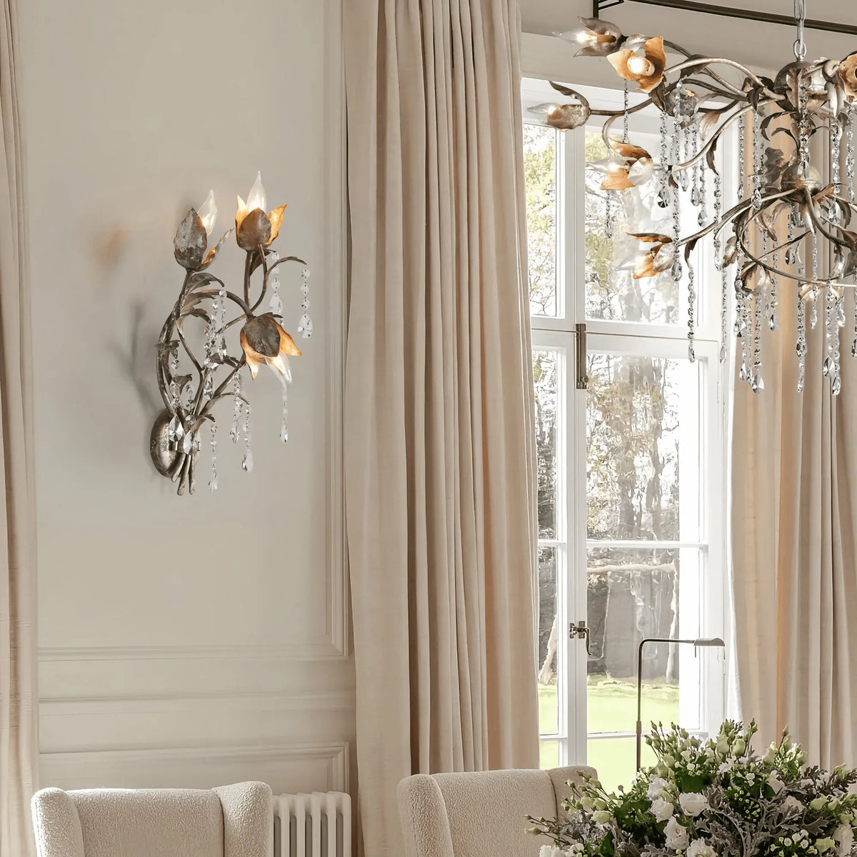 Vitalba 3-Light Wall Sconce styled in a modern bedroom