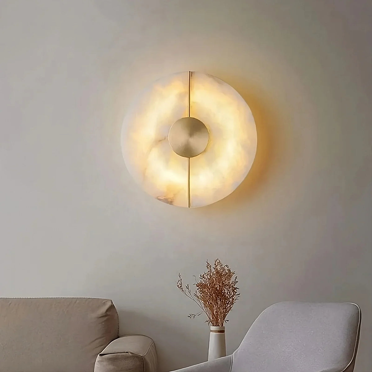 Altura hand-carved marble disc wall sconce with brass inlay
