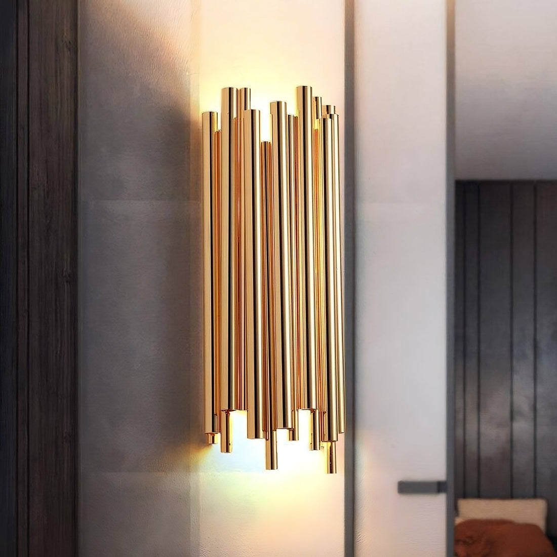 Vigo stainless steel wall sconce by Morsale.com, slender polished steel rods rising from a compact backplate with warm G9 LED light.