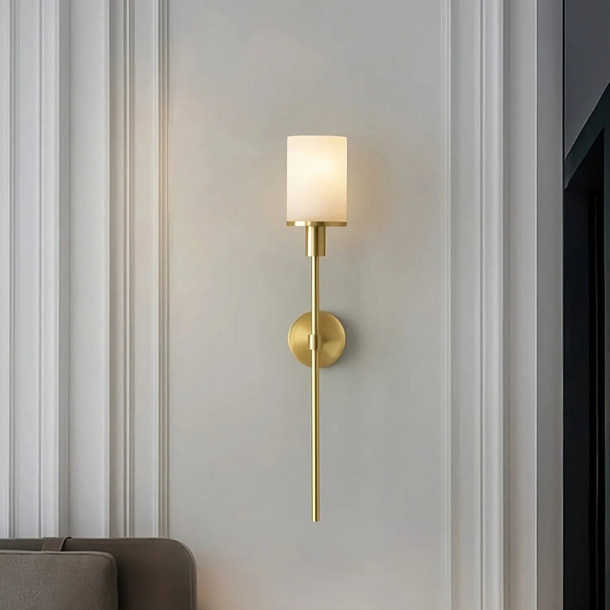 Caldera marble and brass wall sconce mounted on a wall