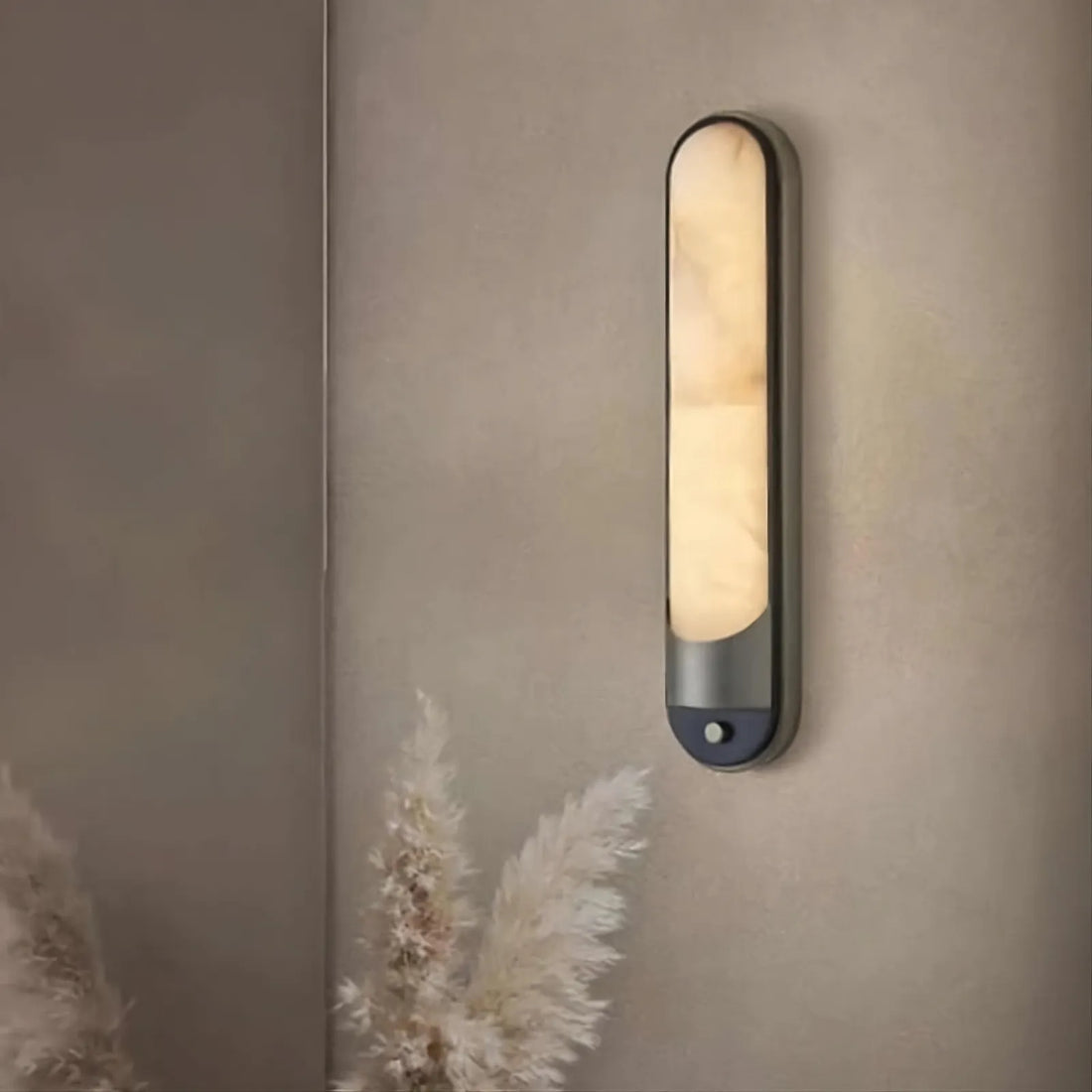 Sandford marble and stainless steel wall sconce in a hallway