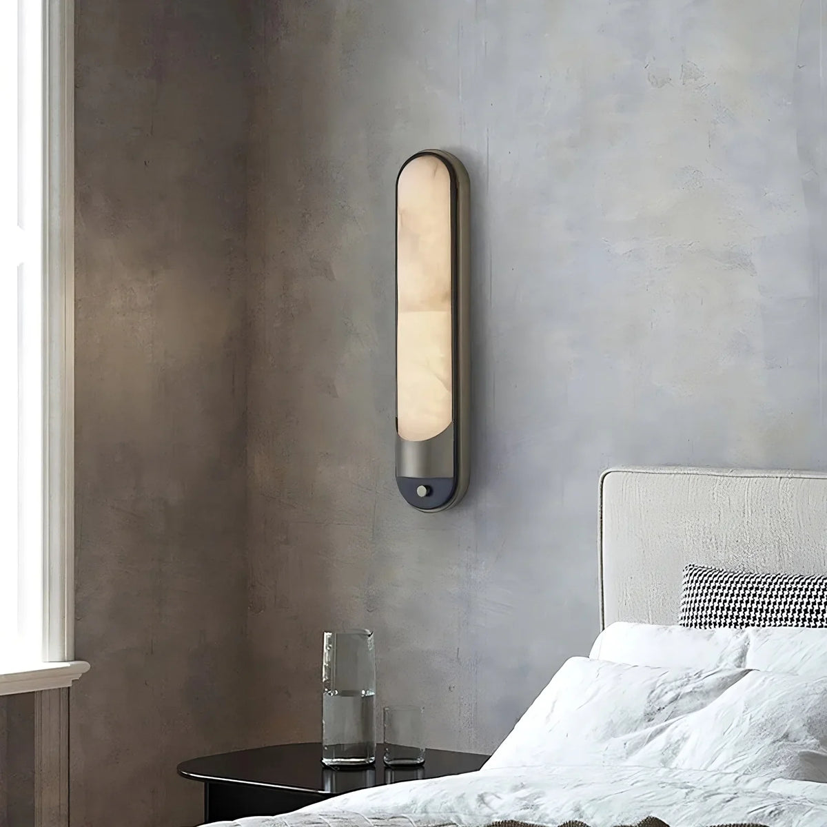 Natural marble shade on a stainless steel sconce body