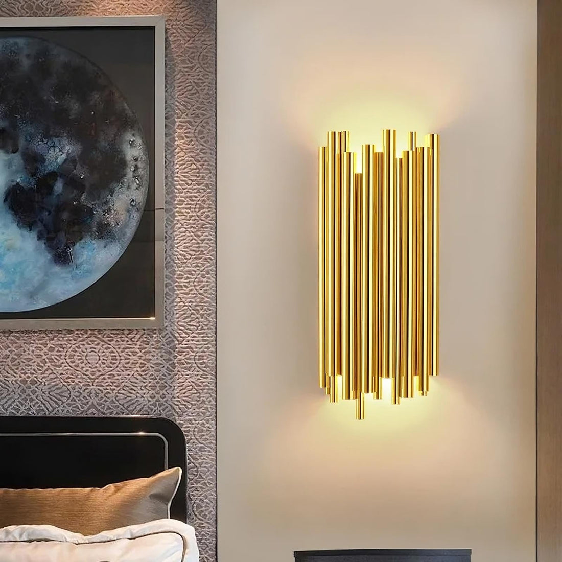 Vigo stainless steel wall sconce by Morsale.com, slender polished steel rods rising from a compact backplate with warm G9 LED light.