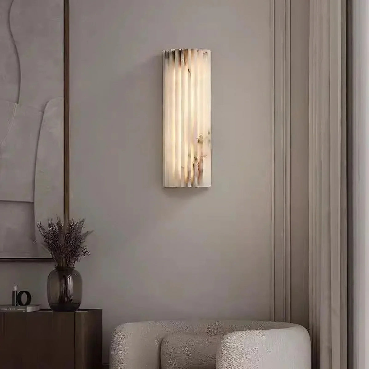 Marlo 12-inch marble sconce with glowing stone shade